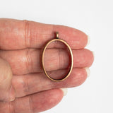 Oval Open Bezel, Antique Copper, Held In Hand