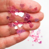 Multi Size Pink Heart Inclusions For Resin , Held In Hand