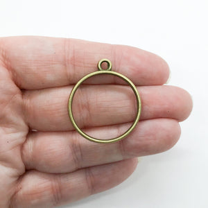 2mm Thick Round Antique Bronze Open Bezel For Resin, Held In Hand